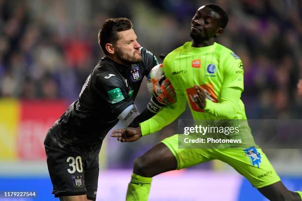 Hendrik Van Crombrugge goalkeeper of Anderlecht collapse with Nana Akwasi Asare defender of KAA Gent during the Jupiler Pro League match between RSC...