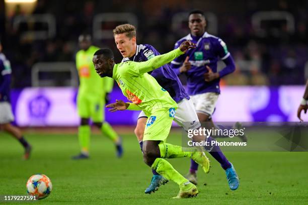 Nana Akwasi Asare defender of KAA Gent holds off the challenge of Yari Verschaeren midfielder of Anderlecht during the Jupiler Pro League match...