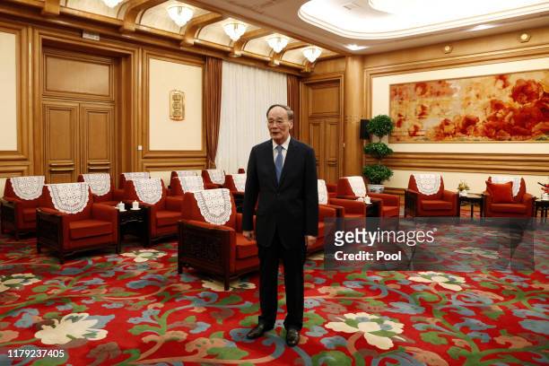 Chinese Vice President Wang Qishan awaits the arrival of Ecuadoran Foreign Minister Jose Valencia at the Zhongnanhai leadership compound November 1,...