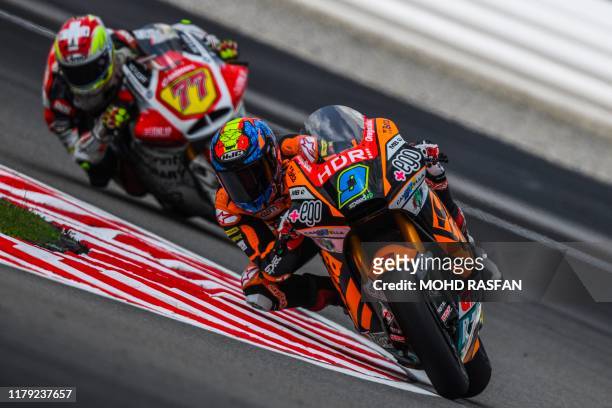Beta Tools Speed Ups Spanish rider Jorge Navarro and MV Agusta Idealavoro Forwards Swiss rider Dominique Aegerter take a corner during the first...