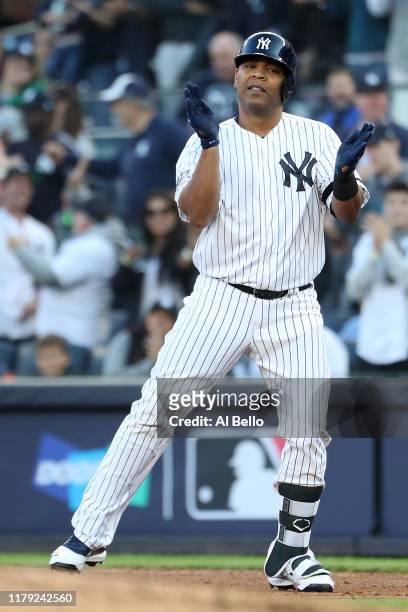 Edwin Encarnacion of the New York Yankees reacts after his RBI single off Randy Dobnak of the Minnesota Twins in the first inning of game two of the...