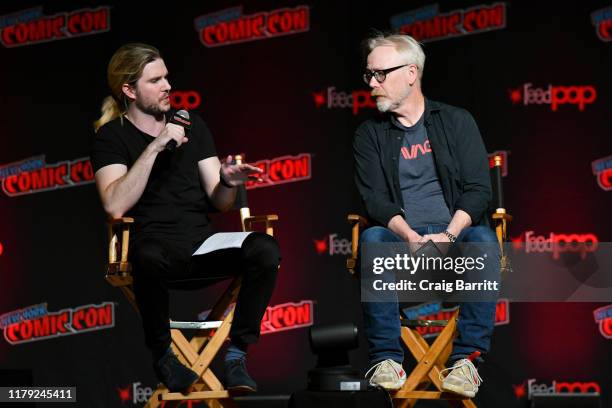 Kyle Hill and Adam Savage speak onstage during the An Hour with Adam Savage panel during New York Comic Con 2019 Day 3 at Jacob K. Javits Convention...