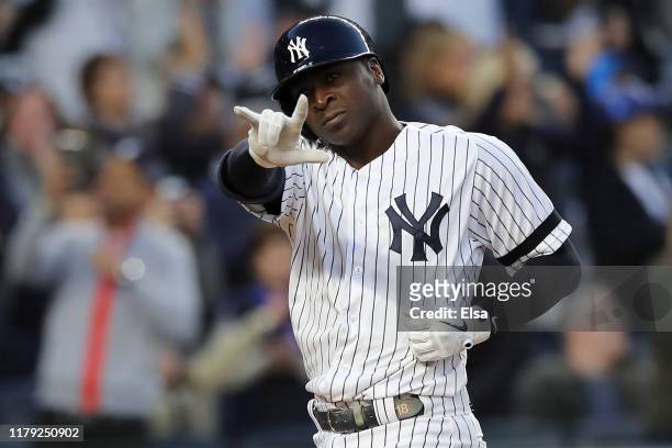 Didi Gregorius of the New York Yankees celebrates after his grand slam home run off Tyler Duffey of the Minnesota Twins in the third inning in game...