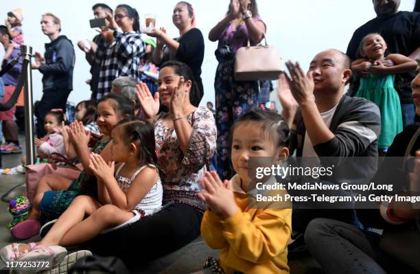 The audience applauds Cambodian dancers from the Khmer Arts Academy during the Aquarium of the Pacific's 15th Annual Southeast Asia Day in Long Beach...