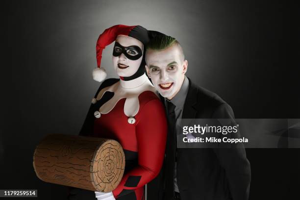 Cosplayers as Harley Quinn and the Joker pose during New York Comic Con at the Javits Center on October 05, 2019 in New York City.