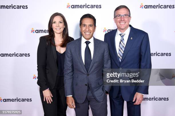Erica Hill, Dr. Sanjay Gupta, and Michael J. Nyenhuis attend the 2019 Americares Airlift Benefit at JPMorgan Chase Hangar at Westchester County...