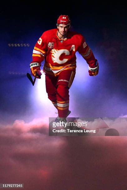 Sean Monahan of the Calgary Flames skates for the pre-game ceremonies at Scotiabank Saddledome before the game against the Vancouver Canucks on...