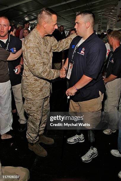 Chairman of the Joint Chief of Staff General Peter Pace with Wounded Marine Patrick Meyer who lost his legs in Iraq