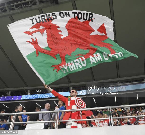 Wales fan cheers ahead of a Rugby World Cup bronze medal match against New Zealand on Nov. 1 in Chofu, western Tokyo.