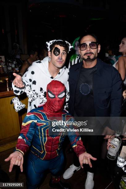 Darren Criss and Eric Podwall attend Podwall Entertainment's 10th Annual Halloween Party presented by Maker's Mark on October 31, 2019 in West...