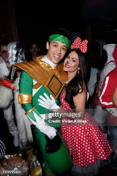 Kyle Hanagami and Kathryn Smith attend Podwall Entertainment's 10th Annual Halloween Party presented by Maker's Mark on October 31, 2019 in West...