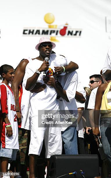 Gary Payton and Dwyane Wade of the Miami Heat celebrate during the victory parade and celebration at American Airlines Arena on June 23, 2006 in...