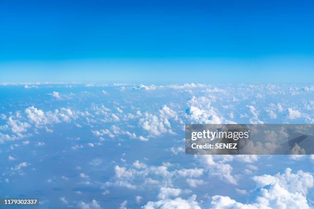 aerial shot of blue sky with clouds - above clouds stock-fotos und bilder