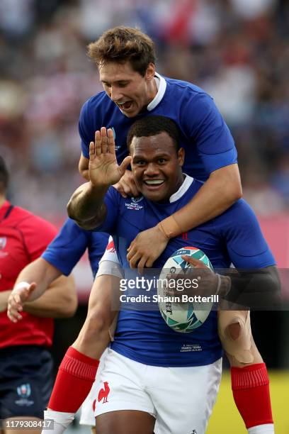 Virimi Vakatawa of France celebrates with Baptiste Serin of France after scoring his team's first try during the Rugby World Cup 2019 Group C game...