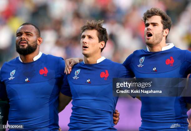 Jefferson Poirot, Baptiste Serin, Damian Penaud of France sing the national anthem prior to the Rugby World Cup 2019 Group C game between France and...