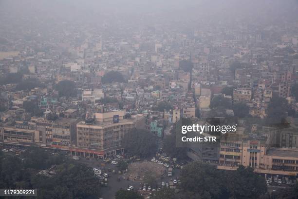 This aerial photograph shows heavy pollution smog covering the capital city of Delhi on November 1, 2019.