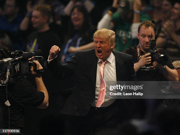 Donald Trump celebrates his victory over Vince McMahon at the main event of the night, "Hair vs. Hair", between Vince McMahon and Donald Trump....