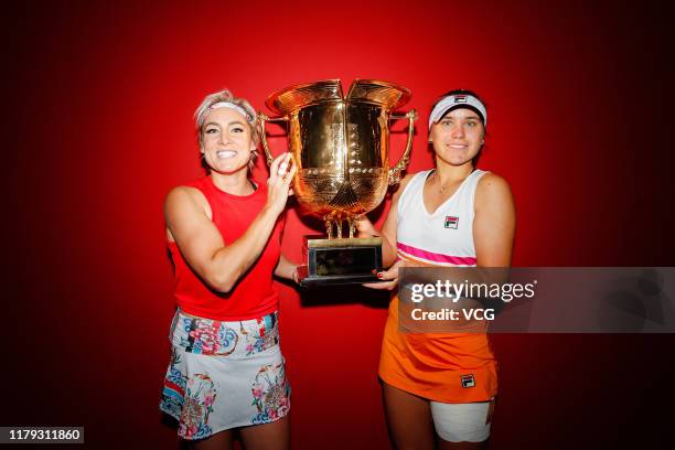 Sofia Kenin and Bethanie Mattek-Sands of the United States pose with the champion trophy after the Women's Doubles final match against Jelena...