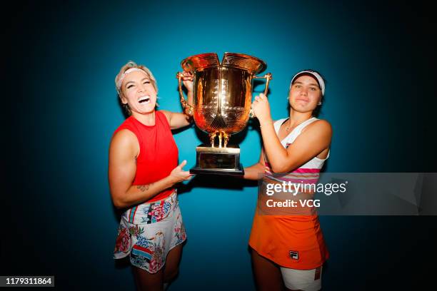 Sofia Kenin and Bethanie Mattek-Sands of the United States pose with the champion trophy after the Women's Doubles final match against Jelena...
