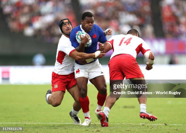 Virimi Vakatawa of France is tackled by Cooper Vuna and Malietoa Hingano of Tonga and during the Rugby World Cup 2019 Group C game between France and...