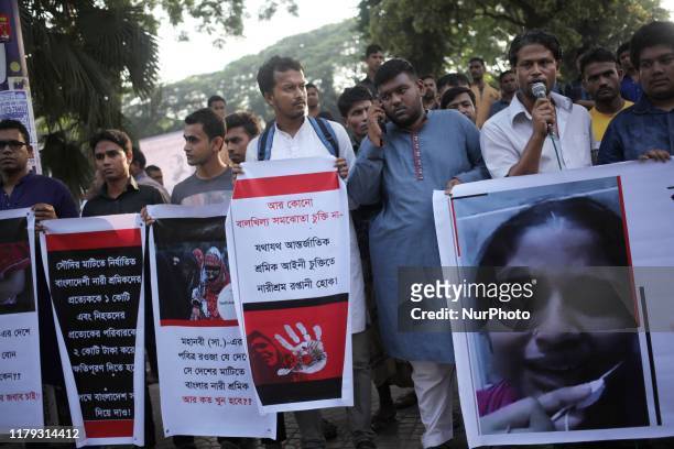 Social activists seen standing in a human chain to protest and raise awarness for bangaldeshi female migrant worker who face various abuses including...