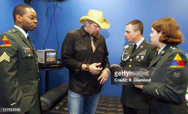 Toby Keith greets special guests - Sergeant Marquette Whiteside, Sergeant Ronald Buxton and Specialist Billie Grimes, the soldiers featured on the...