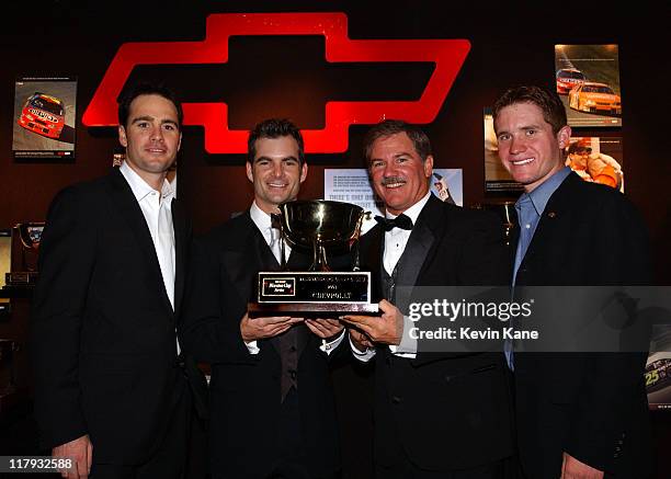 Winston Cup drivers and Hendrick Motorsports teamates pose with the 2003 Chevrolet Manufacturer's Championship trophy. Jimmie Johnson, Jeff Gordon,...