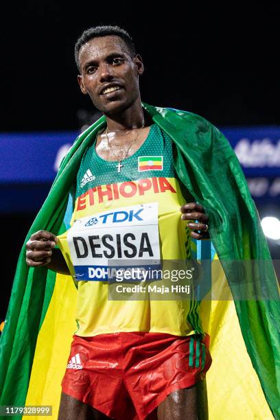 Lelisa Desisa of Ethiopia celebrates after winning the Men's Marathon during day nine of 17th IAAF World Athletics Championships Doha 2019 on October...