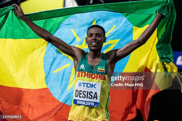 Lelisa Desisa of Ethiopia celebrates after winning the Men's Marathon during day nine of 17th IAAF World Athletics Championships Doha 2019 on October...