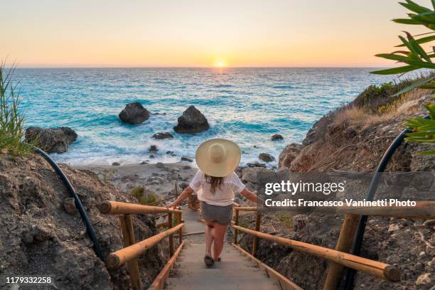 woman at kavalikefta beach, lefkada, greece. - leucadia stock pictures, royalty-free photos & images