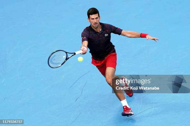 Novak Djokovic of Serbia returns a shot during his singles final against John Millman of Australia on day seven of the Rakuten Open at the Ariake...