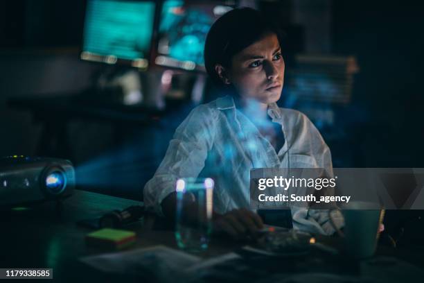 policewoman working late - chief technology officer stock pictures, royalty-free photos & images