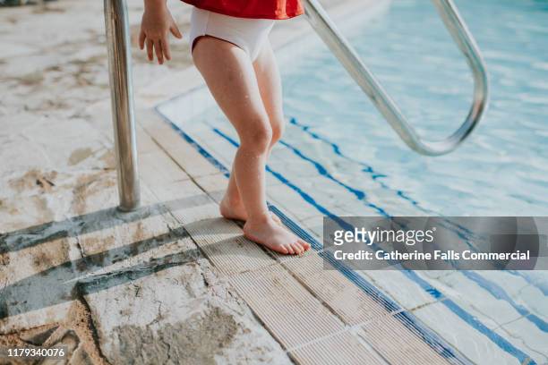 little swimmer - dip toe stock pictures, royalty-free photos & images