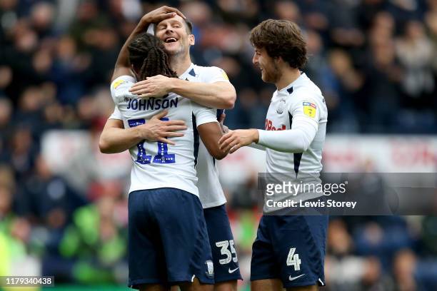 Daniel Johnson of Preston North End celebrates with teammates David Nugent and Ben Pearson after scoring his sides opening goal during the Sky Bet...
