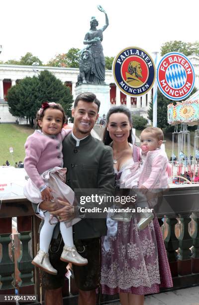 Philippe Coutinho of FC Bayern Muenchen, his wife Aine Coutinho and daughters attend the Oktoberfest at Kaefer Wiesenschaenke tent at Theresienwiese...