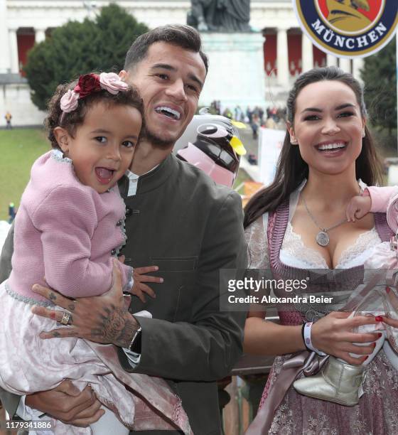 Philippe Coutinho of FC Bayern Muenchen, his wife Aine Coutinho and daughter attend the Oktoberfest at Kaefer Wiesenschaenke tent at Theresienwiese...