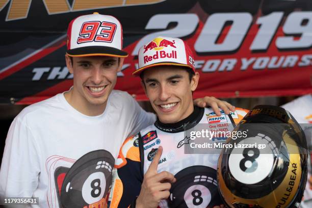 Marc Marquez of Spain and Repsol Honda Team celebrates the MotoGP victory and the 2019 MotoGP Championship with his brother Alex Marquez at the end...