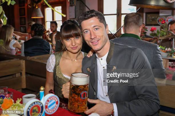 Robert Lewandowski of FC Bayern Muenchen and his wife Anna Lewandowska attend the Oktoberfest at Kaefer Wiesenschaenke tent at Theresienwiese on...