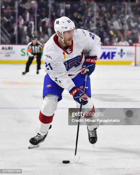 Dale Weise of the Laval Rocket skates the puck against the Cleveland Monsters at Place Bell on October 4, 2019 in Laval, Canada. The Cleveland...