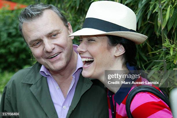 Jean-Charles de Castelbajac and his wife Mareva Galanter pose in the 'Village', the VIP area of the French Open at Roland Garros arena in Paris,...