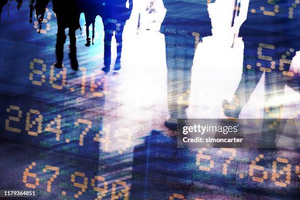 traders in financial district with trading screen data. - fintech imagens e fotografias de stock