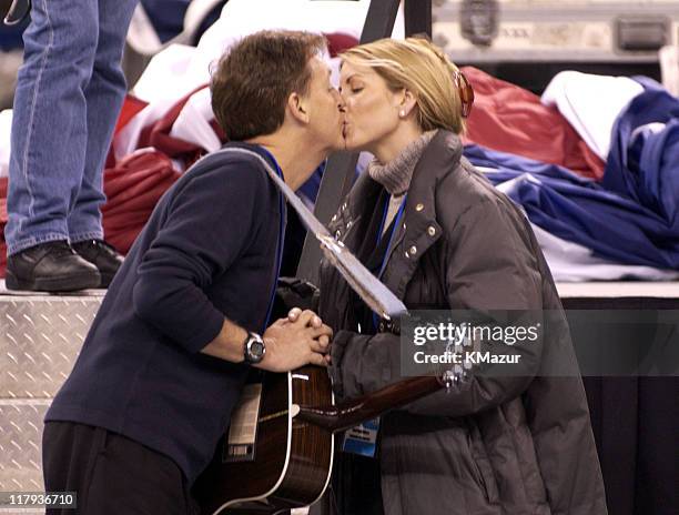 Sir Paul McCartney kisses his fiancee, Heather Mills, during his sound check for the Super Bowl XXXVI Pre-Game Show, February 3 at the Superdome in...