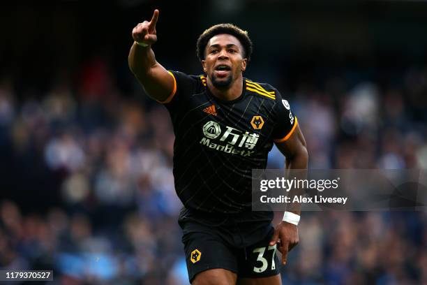 Adama Traore of Wolverhampton Wanderers celebrates after scoring his team's second goal during the Premier League match between Manchester City and...