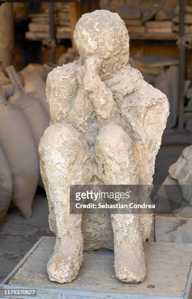 victim covered in ash, pompeii, naples, travel in italy. - herculaneum stock pictures, royalty-free photos & images