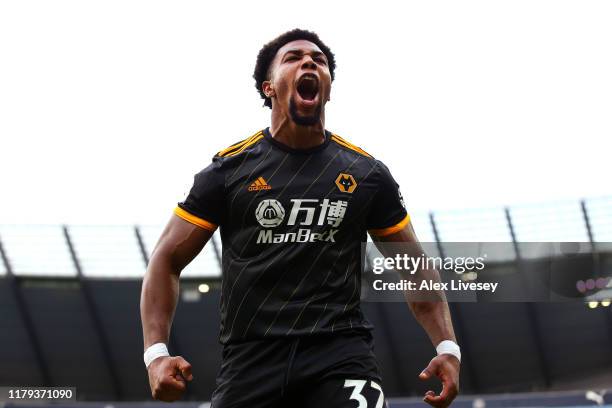 Adama Traore of Wolverhampton Wanderers celebrates after scoring his team's second goal during the Premier League match between Manchester City and...