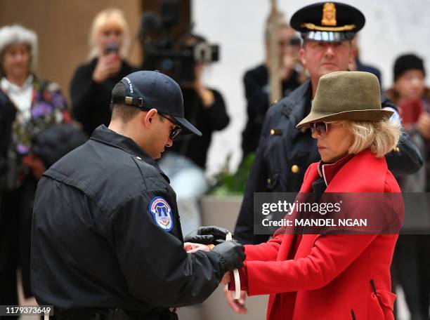 Actress and activist Jane Fonda is arrested by Capitol Police during a climate protest inside the Hart Senate office building on November 1, 2019 in...