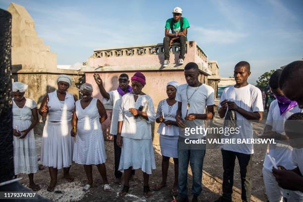 Voodoo faithful celebrate Baron Samedi during a ceremony commemorating the Day of the Dead at the Cemetery De Drouillard in Port-au-Prince on...