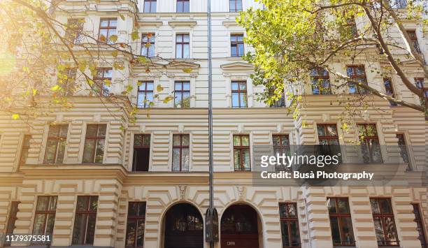 facades of pre-war residential buildings in the district of prenzlauer berg, berlin, germany - prenzlauer berg stock pictures, royalty-free photos & images