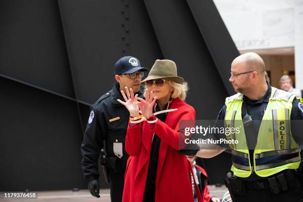 Actress Jane Fonda is arrested by U.S. Capitol Police officers during a ''Fire Drill Fridays'' climate change protest inside the Hart Senate Office...