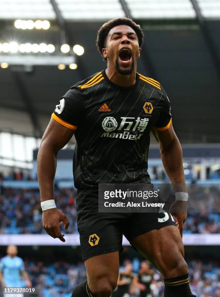 Adama Traore of Wolverhampton Wanderers celebrates after scoring his team's second goal during the Premier League match between Manchester City and...